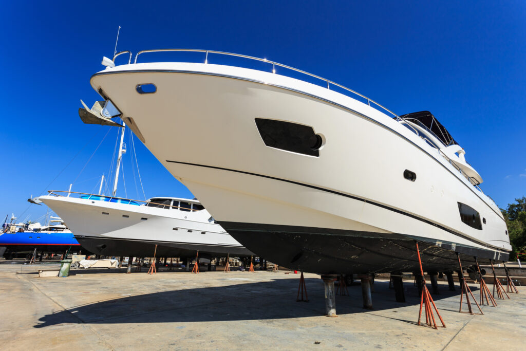 a couple of white boats parked next to each other